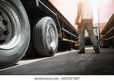 Trailer Truck on The Parking Lot. Truck Drivers Holding Clipboard Checking Wheels and Tires. Maintenance Checklist. Truck Inspection Safety Driving. Freight Truck Transport.	 - Powered by Shutterstock