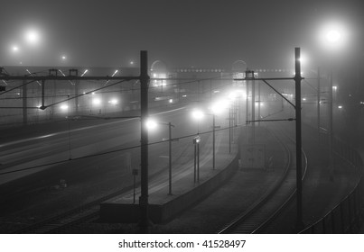 Train arriving at foggy railway station at night - Powered by Shutterstock