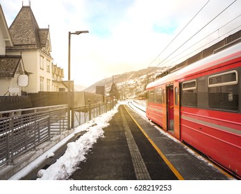 Train From Bergen To Voss City Of Winter Season And Snow And Gold Light Sky Background, Norway