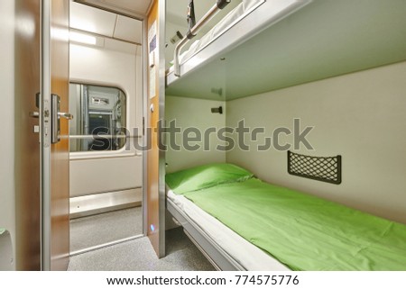 Train berth corridor indoor with two beds. Travel background. Horizontal