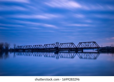 Train Bridge On The Saginaw River In Bay City During Blue Hour.