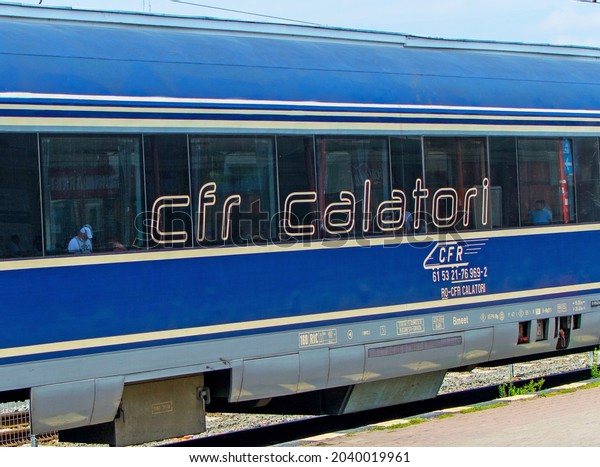 Train car\
with the logo of the Romanian National Railway Company - CFR\
Călători. Romania, Bucuresti. August, 27,\
2021