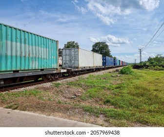 The Train Is Carrying Containers. Diesel Engine Train Of Thailand.