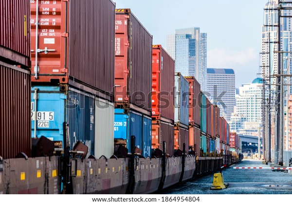 Train carrying\
containers on train\
tracks
