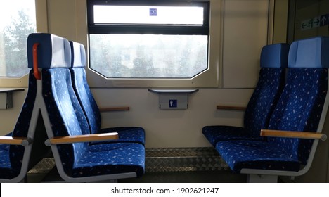 Train Chairs And View Through Window. Comfortable Chairs On A Modern Train, With Beautiful View Through The Window. Empty Interior Of The Train For Long And Short Distance In Europe.