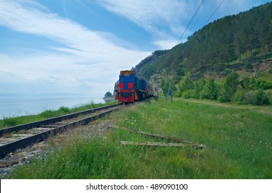 The Train Circum-Baikal Railroad On The Coast Of Lake Baikal.