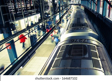 Train And Commuters In New York City Subway With Motion Blur