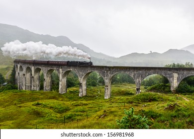 Train Crossing The Glenfinnan Viaduct, Scotland, UK