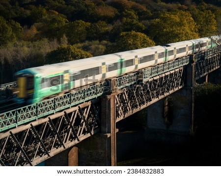 A train crossing a viaduct in southern england.