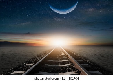 The train cuts through the desert in the mornings, with a half-moon, to be beautifully laid.