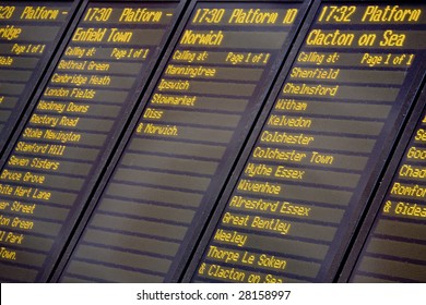 A train departures board and timetable, Liverpool Street railway station, London UK