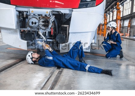 Train engineer working, Train mechanic check inspecting railway track and engine at Train station depot, Advance transport engineering