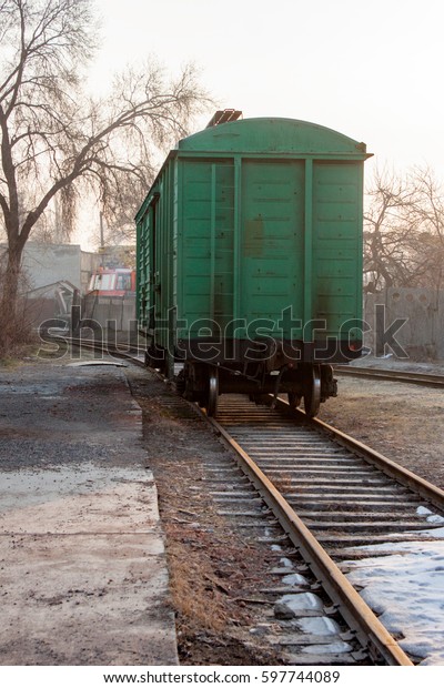 Train freight car\
green color on the rails