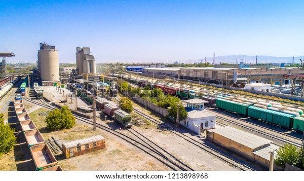 Train freight cars.\
Railway composition, export and import goods, pebbles of trucks\
with cement, with transportation of railways with fuel and coal\
cars from the factory