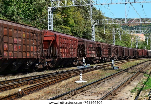 Train with\
freight cars waiting for\
departure.