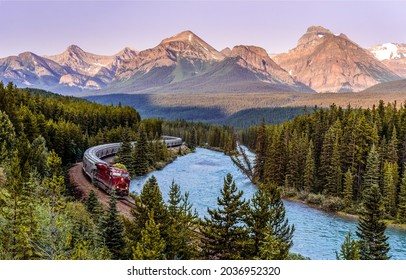 The train goes along the mountain river. Mountain forest train ride. Train in mountain forest. Train in mountains