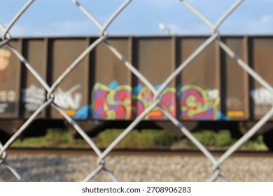 Train with graffiti through barbwire 