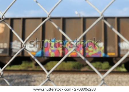 Train with graffiti through barbwire 