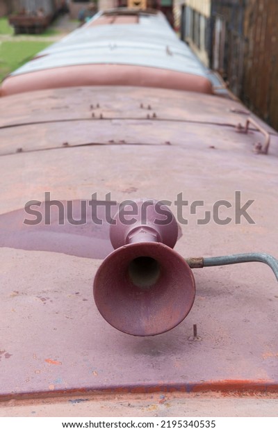 train\
horn located on the roof of a former train\
carriage