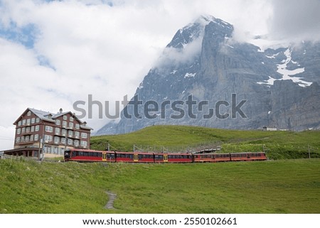 train at Kleine Scheidegg station, Eiger mountain, swiss alps attraction Bernese Oberland