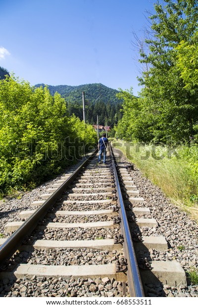  Train lines ,nature ,sky ,green ,mountains,\
journey ,trees ,peacefully