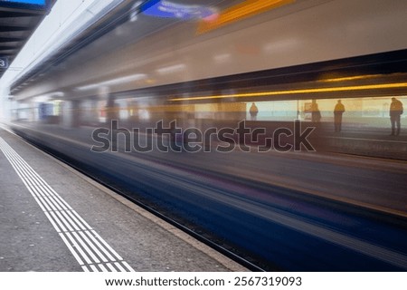 Train in motion at the train station, shot with low exposure