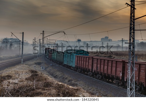 The train moves by rail\
road