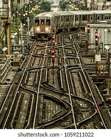 Train on elevated tracks within buildings at the Loop, Chicago City Center - Black Gold Artistic Effect - Chicago, Illinois, USA