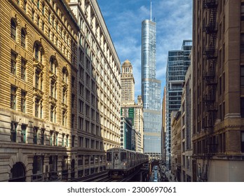 Train on elevated tracks within buildings at the Loop, Glass and Steel bridge between buildings, Chicago City Center, Chicago, Illinois, USA