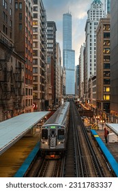 Train on elevated tracks within buildings at the Loop, Glass and Steel bridge between buildings, Chicago City Center, Chicago, Illinois, USA