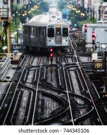 Train on elevated tracks within buildings at the Loop, Chicago City Center - Soft and Grainy Artistic Effect - Chicago, Illinois, USA