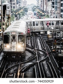 Train on elevated tracks within buildings at the Loop, Chicago City Center - Bleached Portrait Artistic Effect - Chicago, Illinois, USA