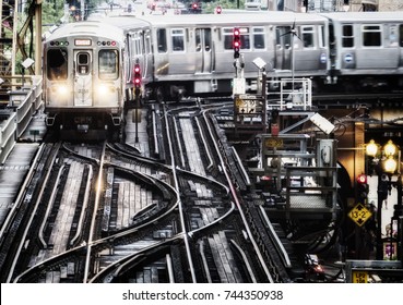 Train on elevated tracks within buildings at the Loop, Chicago City Center - Bleached Portrait Artistic Effect - Chicago, Illinois, USA
