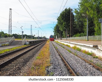 Train on the platform in a small town