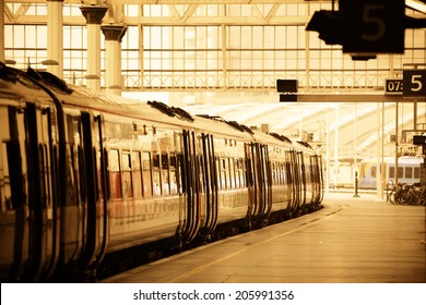 Train on platform in station in London