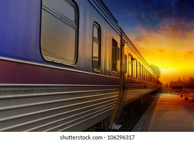 Train Passing By In Orange Sunset