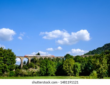 Train Passing On The Chamborigaud Viaduct In The Cévennes, France