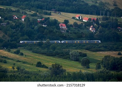 Train passing through the countryside hills