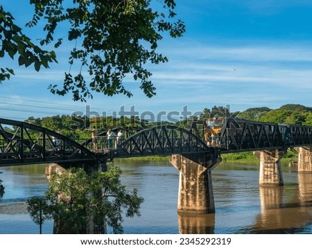 
The train is passing through the Death Railway Bridge over the River Kwai in Kanchanaburi. 
During World War Two Japan constructed railway from Thailand to Burma This is now know the Death Railway.
