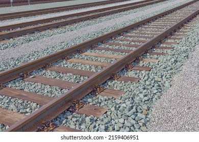Train railroad tracks close up at the freight station in the transshipment port.