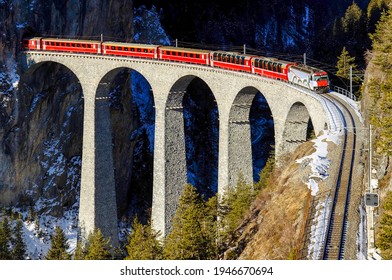 Train ride on railroad bridge in historical Germany - Shutterstock ID 1946670694