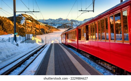Train at the Rigi-Kaltbad railway station in the Alps mountains. Rigi railway, operating from Lake Lucerne to the top of Rigi mountain, is the highest railway in Europe. - Shutterstock ID 2229884627