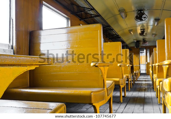 Train seats yellow in the\
old train.