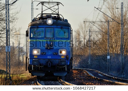 Train in the setting sun.