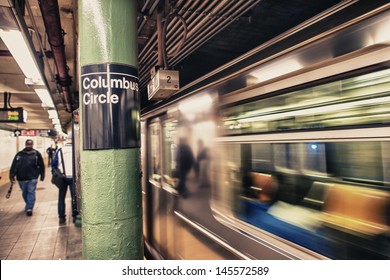 Train speeding up in Columbus Circle subway station - NYC.