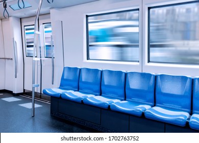 Train station and empty seats commuter with blue color interior inside in the subway train. - Powered by Shutterstock