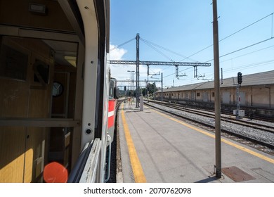 Train station platform of Pivka, slovenia, seen from the window of a passenger train travelling accross europe during a sunny summer afternoon. Slovenian railways are a major rail hub.  - Shutterstock ID 2070762098