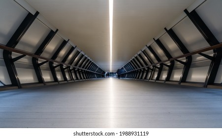 Train Station Tunnel With Geometric Symmetry In Canary Wharf Financial Center Of London, UK