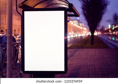 Train Stop Bus Shelter, With Advertising Billboard Light Advertisement For Advertising. Outdoor Advertising Luminous In The Night City. Layout For Advertising. Empty White Field. Bus Stop