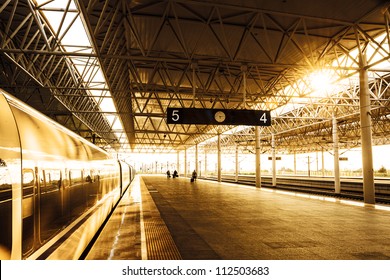 train stop at railway station with sunset